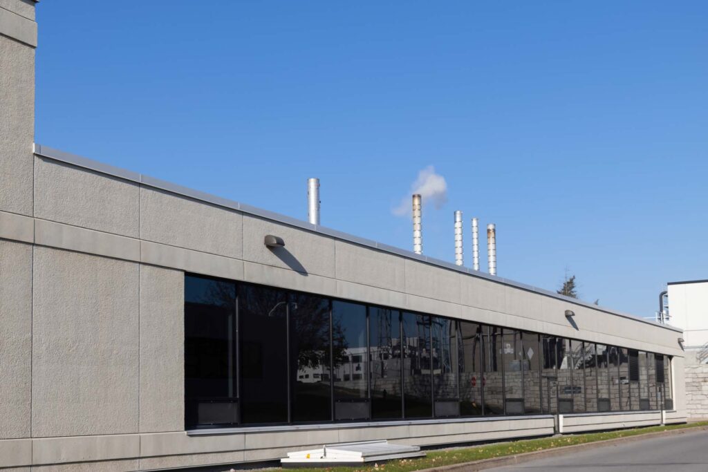Commercial building exterior with clean finish surfaces and large window openings