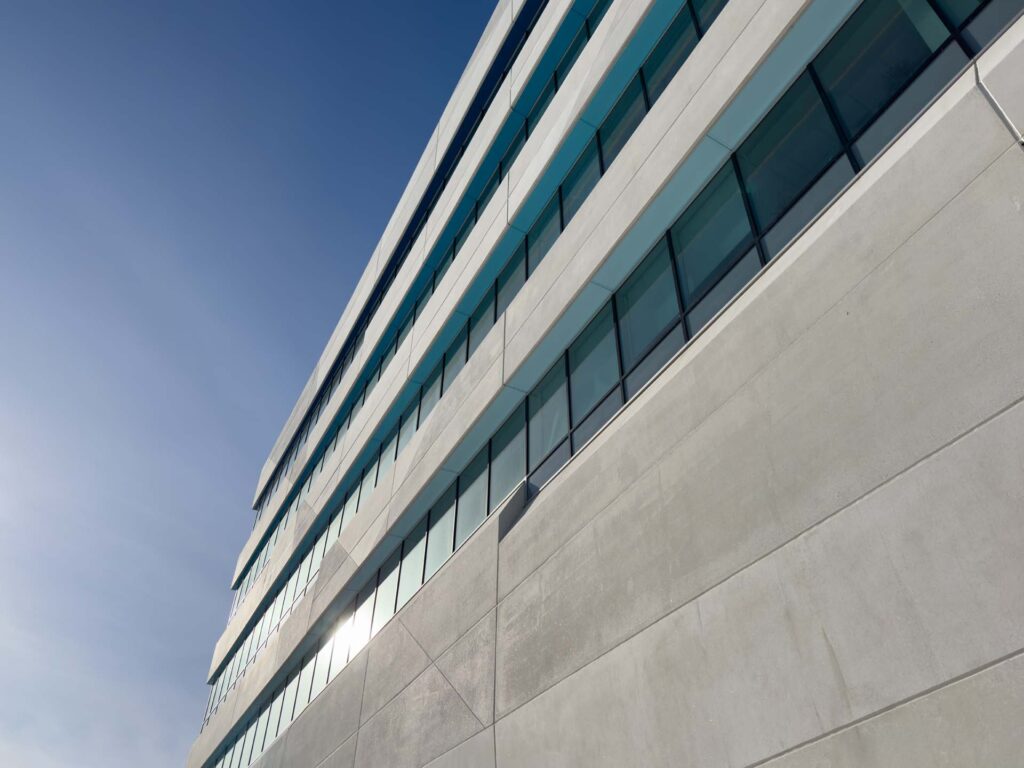 Contemporary commercial building exterior with stucco and EIFS-style finish areas