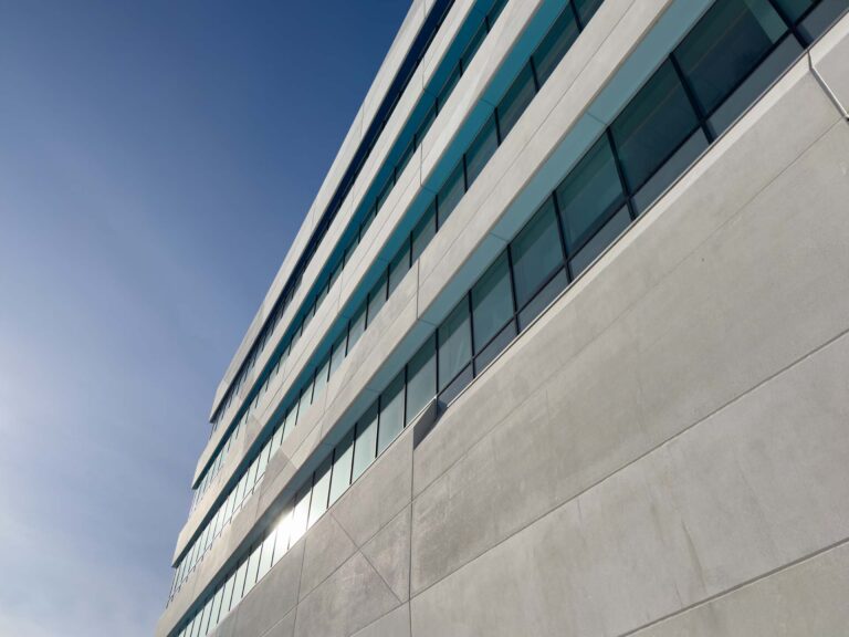 Contemporary commercial building exterior with stucco and EIFS-style finish areas