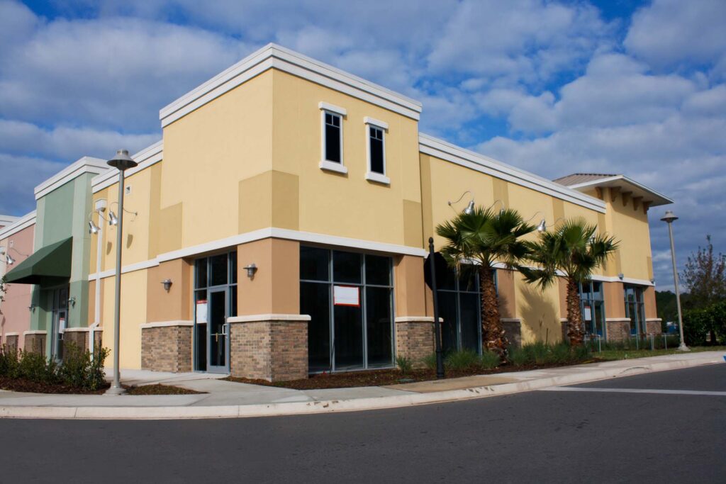 Commercial building exterior with stucco and stone accent finishes